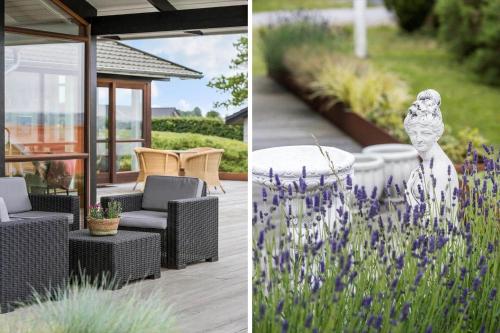 a patio with chairs and a table and purple flowers at 84164-Ronde-Stenhojvej-17 in Rønde