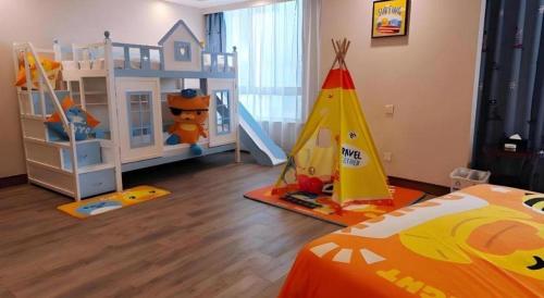a bedroom with a childs room with a play equipment at Sanya Baohong Hotel in Sanya