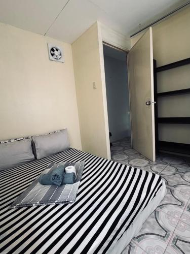 Ένα ή περισσότερα κρεβάτια σε δωμάτιο στο Casa De Hombre