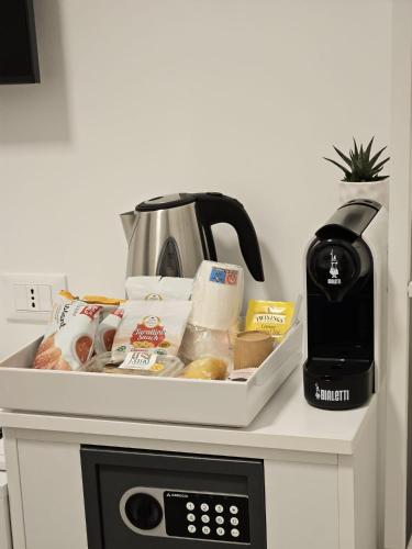 a tray of food on top of a microwave at Ruffini Rooms in Termoli