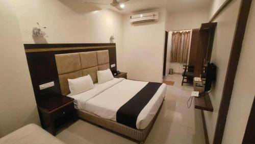 En eller flere senge i et værelse på Collection O Chatrapati Shivaji Bus Terminal Aurangabad