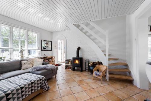 a living room with a couch and a fireplace at 1319-N-Liseleje-Liselejevej-55 in Liseleje