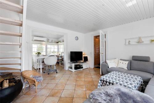 a living room with a couch and a table at 1319-N-Liseleje-Liselejevej-55 in Liseleje