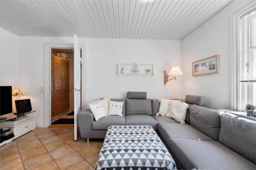 a living room with a couch and a tv at 1319-N-Liseleje-Liselejevej-55 in Liseleje