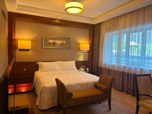 Postel nebo postele na pokoji v ubytování Inn Fine Hotel