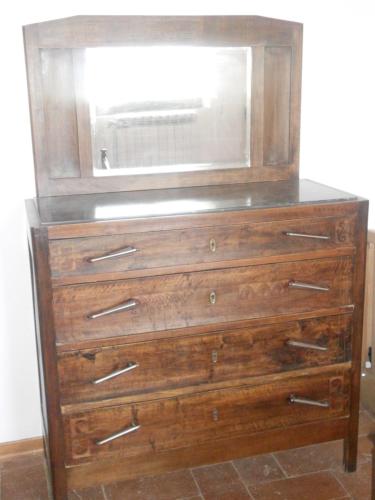 a wooden dresser with a window on top of it at Tenuta Il Tresto in Poggibonsi