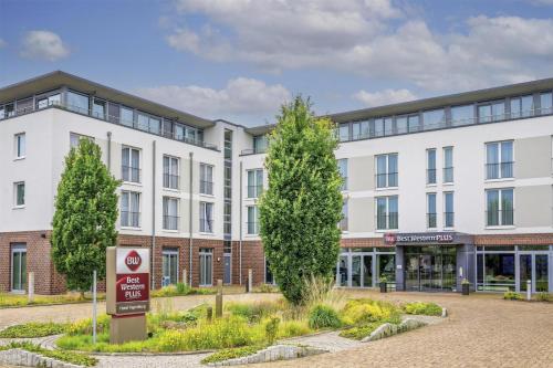 an apartment building with a no parking sign in front at Best Western Plus Hotel Papenburg in Papenburg