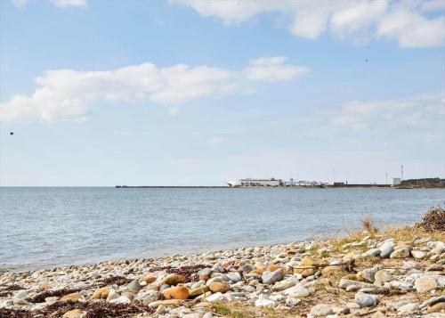 a rocky beach with a large body of water at 12228-Sjaellands-Odde-Strandvaenget-23 in Yderby