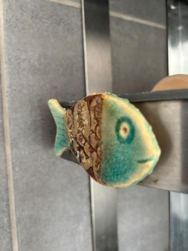 a fish toy is sitting on a table at Beautiful house with a charming garden in Brønderslev