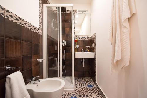 a bathroom with a shower and a sink and a toilet at Ravello House in Ravello