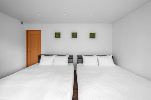 Una cama o camas en una habitación de The CIEL