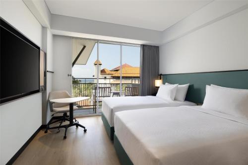 Postel nebo postele na pokoji v ubytování Hilton Garden Inn Bali Nusa Dua