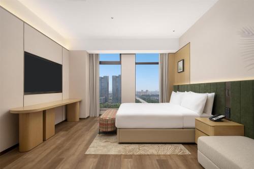 Televisyen dan/atau pusat hiburan di Hilton Garden Inn Linyi Shangcheng