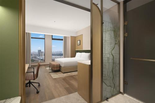 Katil atau katil-katil dalam bilik di Hilton Garden Inn Linyi Shangcheng