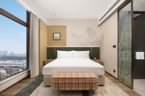 Katil atau katil-katil dalam bilik di Hilton Garden Inn Linyi Shangcheng