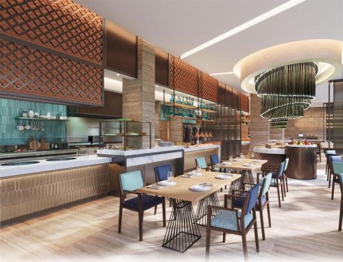 a rendering of a restaurant with tables and chairs at DoubleTree by Hilton Jakarta Kemayoran in Jakarta