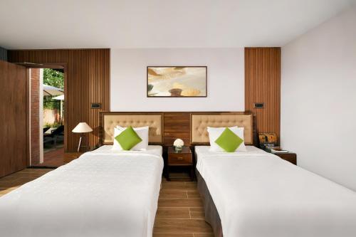 Giường trong phòng chung tại Famiana Green Villa - Complimentary Airport Shuttle