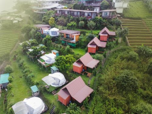 an overhead view of a bunch of houses on a hill at Phu Fahsai Homestay in Mon Jam