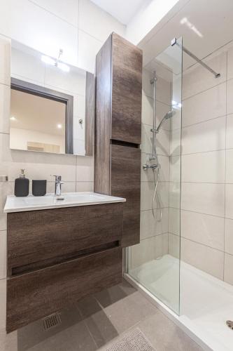 a bathroom with a sink and a shower at Guesthouse No. 48 in Msida