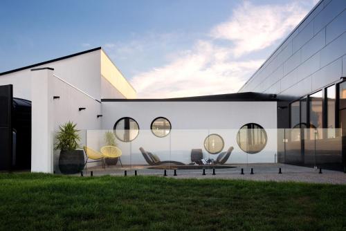 a house with round mirrors on the side of it at Sky High- iconic ridge-top retreat in Hepburn Springs