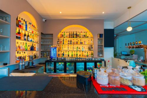 a bar with jars of food on a counter at Treebo Memories Inn in Bengaluru