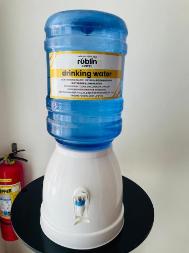 a white mixer with a blue top on a shelf at Rublin Hotel Cebu in Cebu City