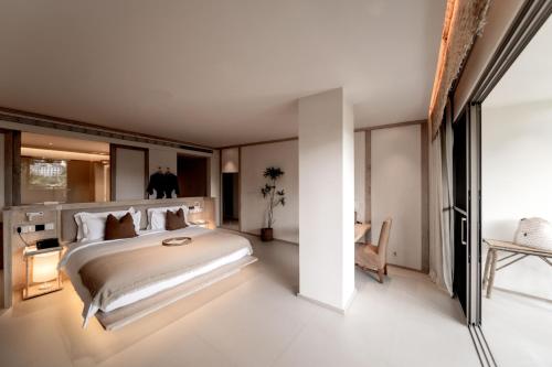 Katil atau katil-katil dalam bilik di Wan'an Tinglan Wild Luxury Resort Hotel
