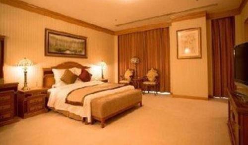 Postel nebo postele na pokoji v ubytování Beijing Jinjiang Fuyuan Hotel