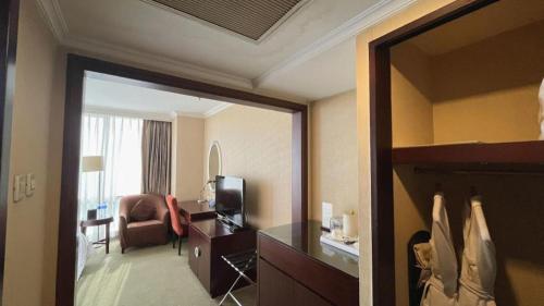 TV a/nebo společenská místnost v ubytování Beijing Jinjiang Fuyuan Hotel