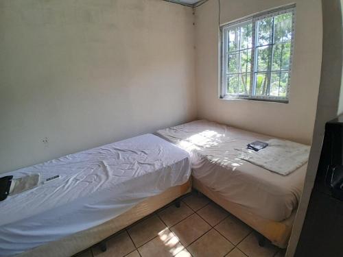 En eller flere senge i et værelse på Apt Playa kilometro 59, Rural area