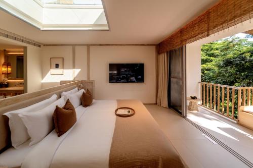 Televisyen dan/atau pusat hiburan di Wan'an Tinglan Wild Luxury Resort Hotel