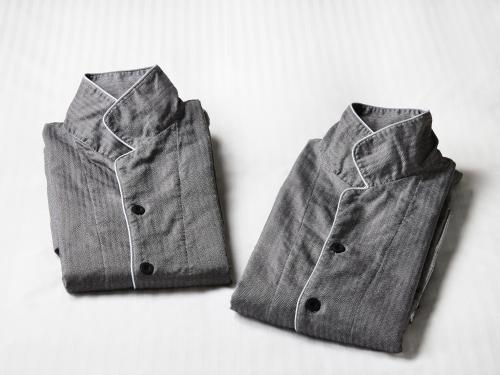 a gray suede jacket sitting on a white background at IN THE LIBRARY hotel and books TOKOROZAWA - Opening in 15th July 2025 in Tokorozawa