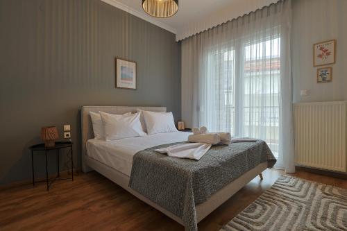 Postel nebo postele na pokoji v ubytování Zeusplace Alice Apartment
