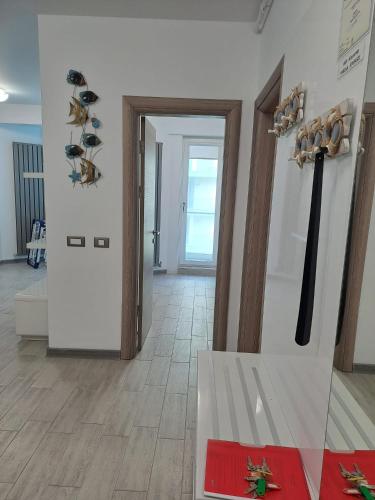 a hallway with a museum with axes on the wall at Alezzi Seaside in Năvodari