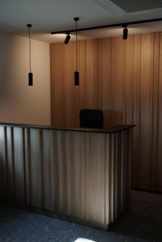 an office with a desk with a chair on top of it at Vineyard Escape Herbersteinova klet in Juršinci