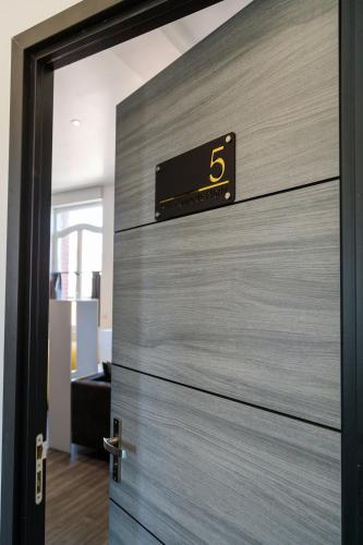 a door with a sign on it in an office at SEE - Gare de Marly in Valenciennes