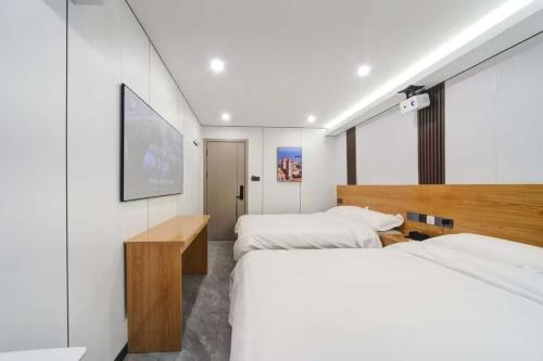 Katil atau katil-katil dalam bilik di Jiumi Hutong Homestay