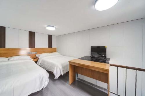 Katil atau katil-katil dalam bilik di Jiumi Hutong Homestay