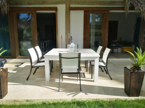 a white table and chairs on a patio at Beautiful Caribbean Villa Coson Beach in Las Terrenas