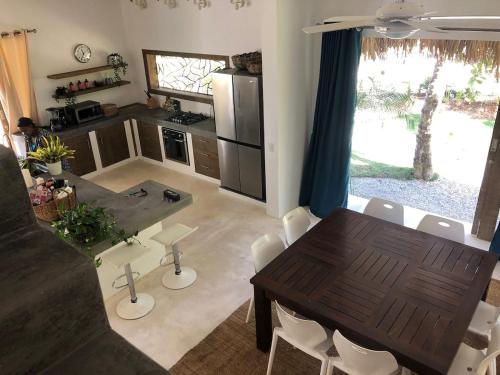 a kitchen and dining room with a table and chairs at Beautiful Caribbean Villa Coson Beach in Las Terrenas