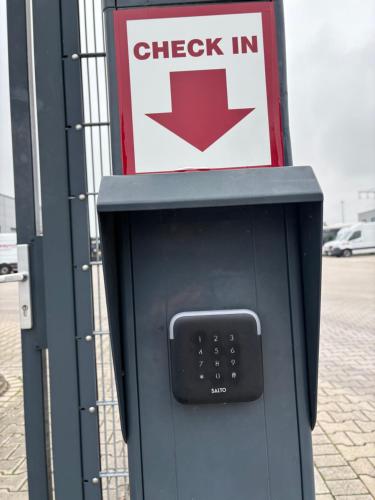 a check in machine in front of a gas station at GP Motel in Neuenkirchen-Vörden