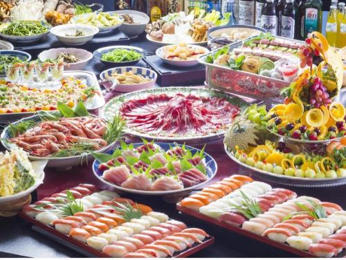 a buffet of different types of food on a table at Hotel North Shiga in Shimotakai
