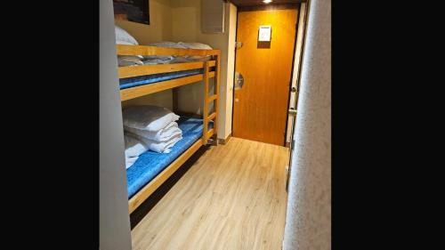a hallway with bunk beds in a room at Piolit andCo - Studio vue montagne in Ancelle