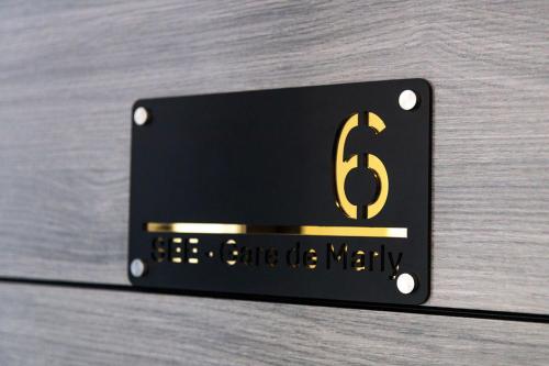 a metal sign with the number six on it at SEE - Gare de Marly in Valenciennes