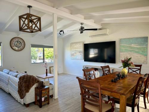 a living room with a table and a couch at One Bedroom with shared bathroom and kitchen in Gold Coast