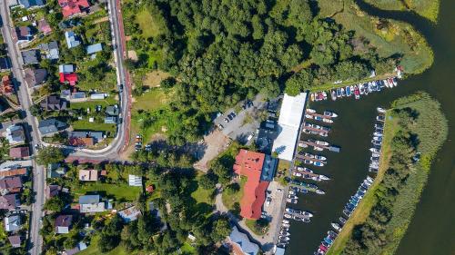 an overhead view of a river with a group of boats at Villa Marina in Augustów