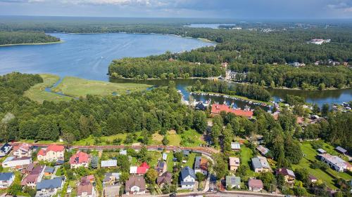an aerial view of a town next to a river at Villa Marina in Augustów