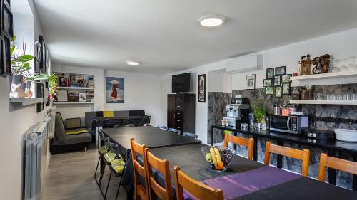 a kitchen and dining room with a table and chairs at Villa Marina in Augustów