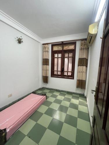 Giường trong phòng chung tại Dung Home - 51 Nghi Tàmm