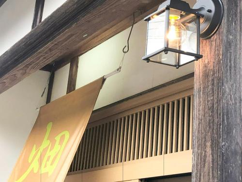 a light hanging from the ceiling of a building at Hatake no Oyado - Vacation STAY 74494v in Takeda